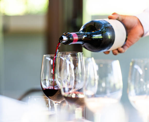 istock A waiter pours a Merlot wine at a wine tasting 2206687379