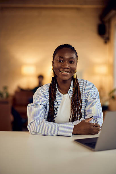 istock Confident Professional Woman Sitting at a Desk in a Cozy Office Setting 2206689412
