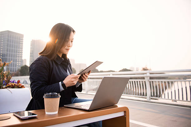 istock asian female business people using digital tablet 2206690180