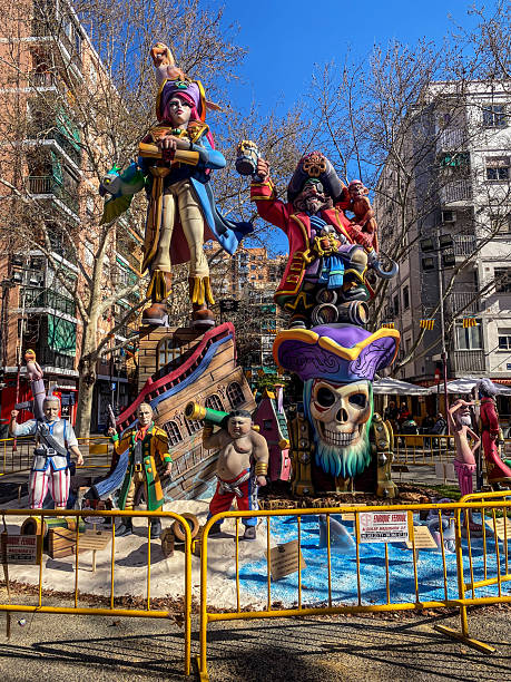 Valencia, Spain - March 16, 2024: Low angle view of arrangement of pirate ninot characters in residential district.  These are huge dolls that are built specifically to be burnt during the last night of Las Fallas annual event, exclusive to the Valencian Community