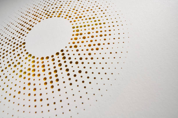 istock Minimalist circular paper cutout artwork with perforated dot pattern revealing warm golden gradient beneath 2206691936