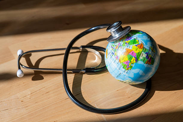 istock Global Medicine Representation: Earth Enveloped By Stethoscope Symbolizing International Healthcare System And Worldwide Medical Services 2206693224