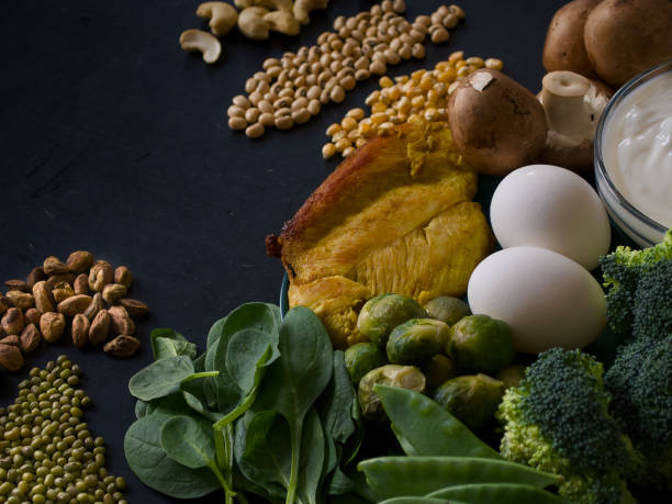 Healthy food for a well balanced diet arranged on black background - food high in protein - healthy eating, protein, copy space