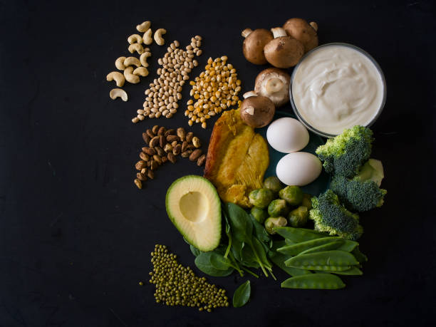 Healthy food for a well balanced diet arranged on black background - food high in protein - healthy eating, protein, copy space