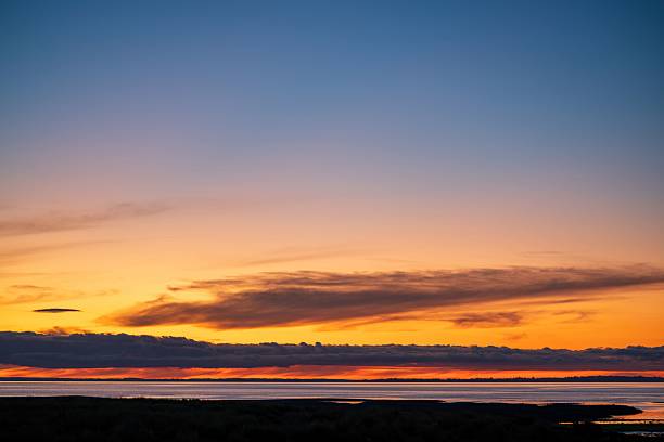 Serene Ocean Sunset with Orange Hues