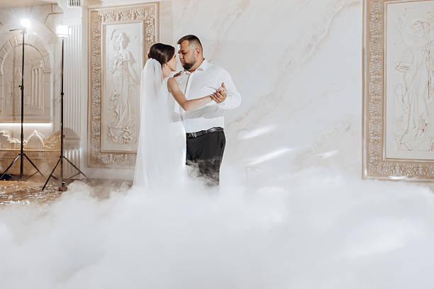 istock A bride and groom are dancing in a misty room 2206699870