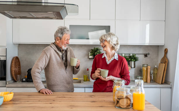 istock Senior couple chatting and drinking coffee in the morning 2206701049