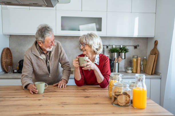 istock Senior couple chatting and drinking coffee in the morning 2206701065