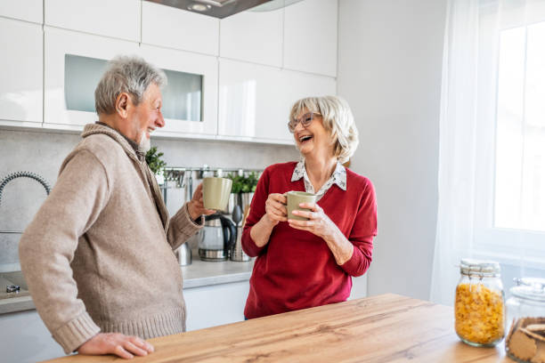 istock Senior couple chatting and drinking coffee in the morning 2206701079