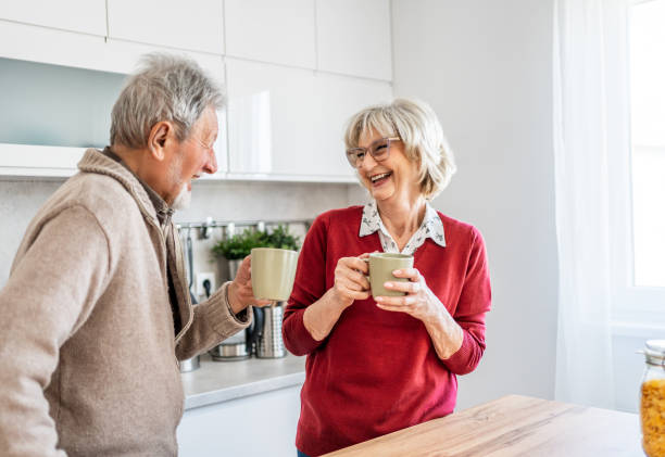 istock Senior couple drinking coffee together 2206701181