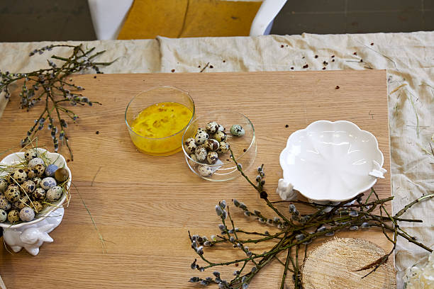 Top view of willow, quail eggs and hay, ingredients for making an Easter wreath