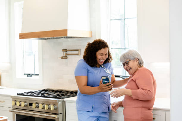 istock Home Healthcare Worker and Patient Using Smartphone 2206702601