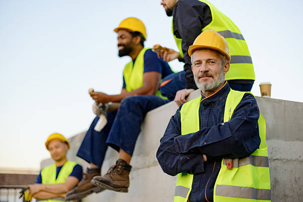 istock Construction Workers Taking a Break on Site with Safety Equipment and Gear 2206703186