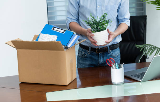 istock Unemployed man packing his belongings 2206704322