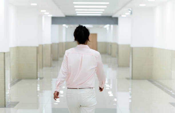 istock Businesswoman walking on the corridor 2206704346