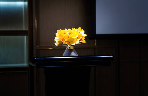 Yellow flowers in the vase on the table