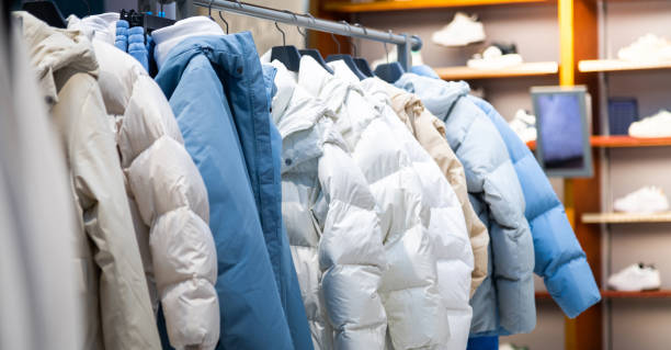 istock Winter down jackets hanging in the store 2206705263