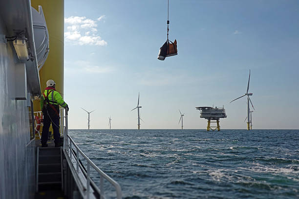 istock Offshore worker overseeing a lift operation at the boat deck. 2206707414