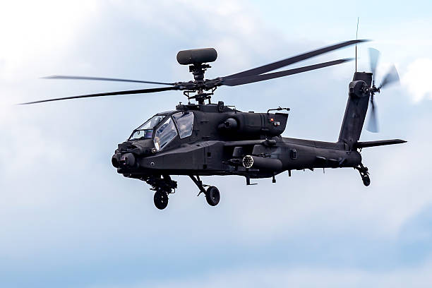 istock Military attack helicopter with spinning rotors. 2206708011
