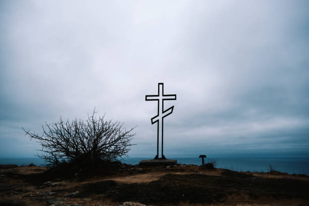 Cross and briar patch above the sea