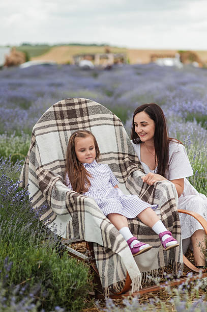 istock Aromatherapy for mother and daughter in a lavender field. 2206712868