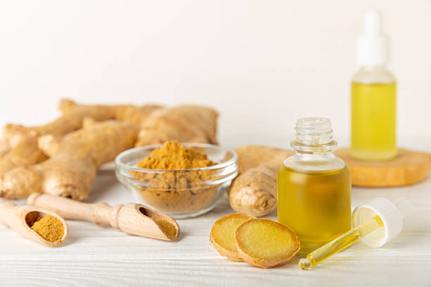 istock Ginger essential oil on texture background. Fresh ginger slices. Essence, serum, oil. Alternative medicine. Phytotherapy. Health and beauty concept. Place for text. Copy space. 2206714451