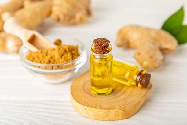 istock Ginger essential oil on texture background. Fresh ginger slices. Essence, serum, oil. Alternative medicine. Phytotherapy. Health and beauty concept. Place for text. Copy space. 2206714468