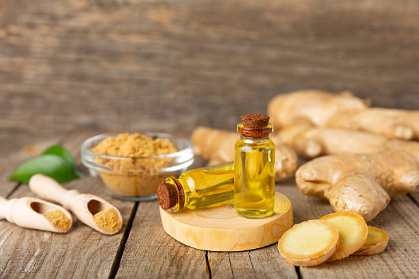 istock Ginger essential oil on texture background. Fresh ginger slices. Essence, serum, oil. Alternative medicine. Phytotherapy. Health and beauty concept. Place for text. Copy space. 2206714475