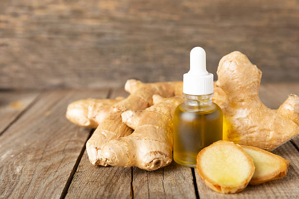 istock Ginger essential oil on texture background. Fresh ginger slices. Essence, serum, oil. Alternative medicine. Phytotherapy. Health and beauty concept. Place for text. Copy space. 2206714485