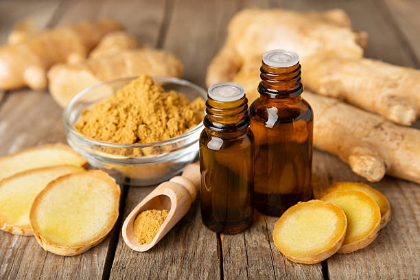 istock Ginger essential oil on texture background. Fresh ginger slices. Essence, serum, oil. Alternative medicine. Phytotherapy. Health and beauty concept. Place for text. Copy space. 2206714498