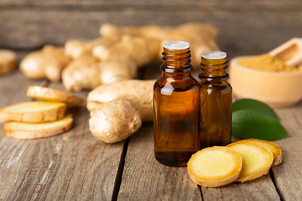 istock Ginger essential oil on texture background. Fresh ginger slices. Essence, serum, oil. Alternative medicine. Phytotherapy. Health and beauty concept. Place for text. Copy space. 2206714501