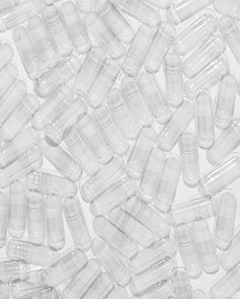 istock Transparent Empty Gelatin Capsules Background, Pharmaceutical Concept 2206718711