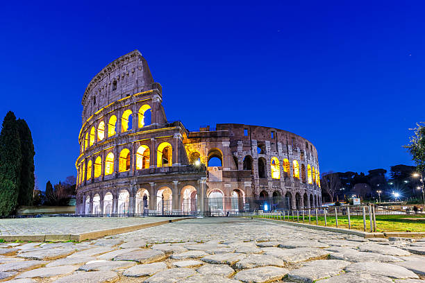 istock Colosseum ancient amphitheater at night in Rome, Italy 2206719073