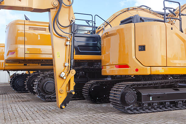istock New yellow crawler excavators are parked on the site. 2206719184