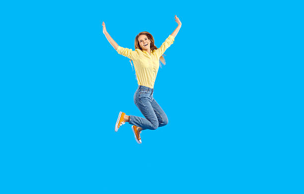 istock Overjoyed girl jump high celebrating success 2206720735