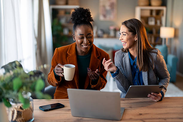 istock Entrepreneurs Collaborating Indoors with Laptops and Coffee 2206722286