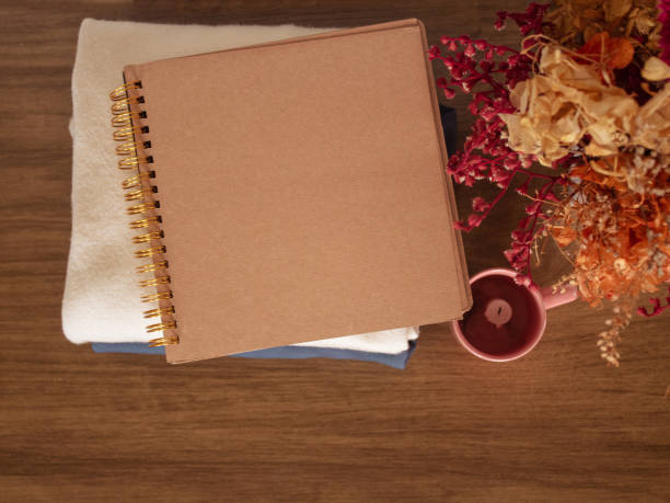 istock A copy space scrapbook on wooden background. 2206722342