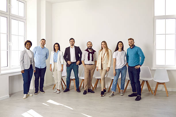 istock Smiling multiethnic employees pose together in office 2206722430