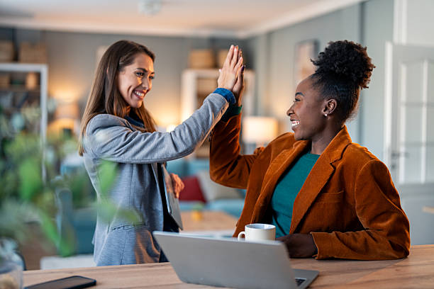 istock Diverse Female Entrepreneurs High-Five in Home Office 2206722675