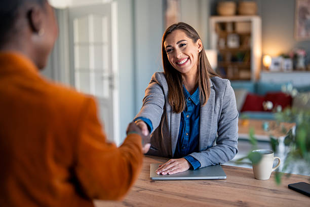 istock Confident Female Entrepreneur Shaking Hands in Startup Meeting 2206722683