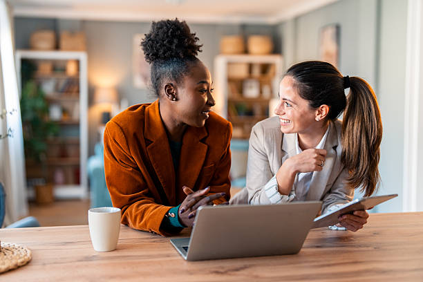 istock Diverse Business Women Sharing Joyful Moment During Remote Work Meeting 2206723094