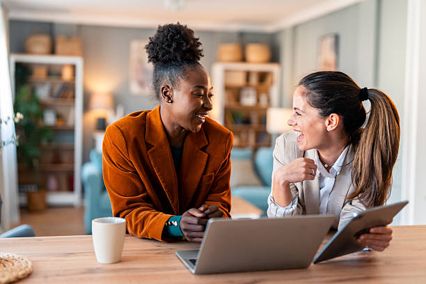 istock Diverse Women Entrepreneurs Collaborating in Bright Home Office 2206723111