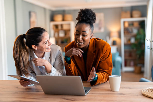 istock Two Professional Women Collaborating in Cozy Home Office 2206723128