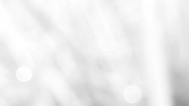 istock Abstract white background with soft, circular bokeh effects, creating a subtle and ethereal feel. Realistic bokeh photos for website banner backgrounds with bright colors. 2206725386