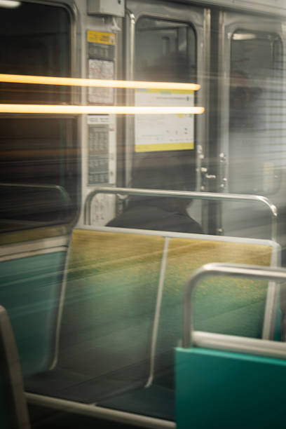 Paris, France - March 4th 2025 : Mystery traveler on a Paris Metro train in Paris - France