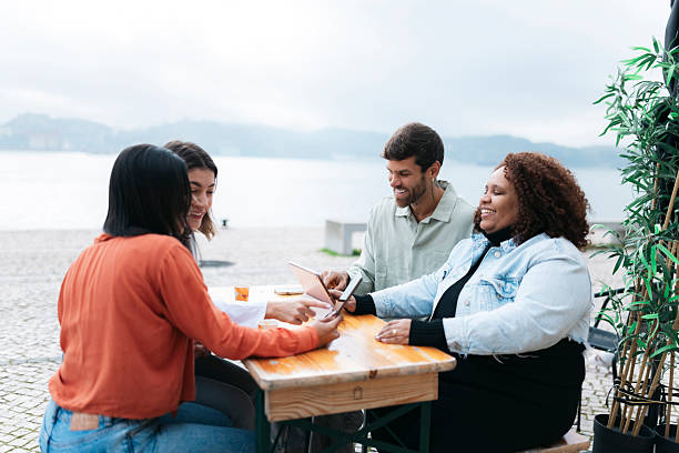 istock Young professionals collaborating on a project by the lake 2206734922