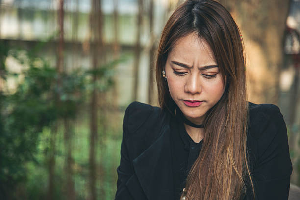istock Recession Stress Woman using laptop work hard at home office headache, depressed from failure business burnout. Tired Asian woman despair stress, overworked, pain sadness life problems frustration 2206742799