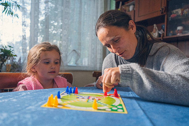 istock Child Development. Family Plays Board Game at Home 2206747378