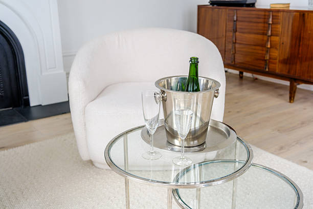 istock Luxurious sparkling wine  Bottle with Ice Bucket on Glass Table 2206747774