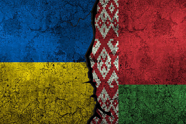 istock Ukraine vs Belarus clash and conflict concept with painted flags on wall, background 2206757434